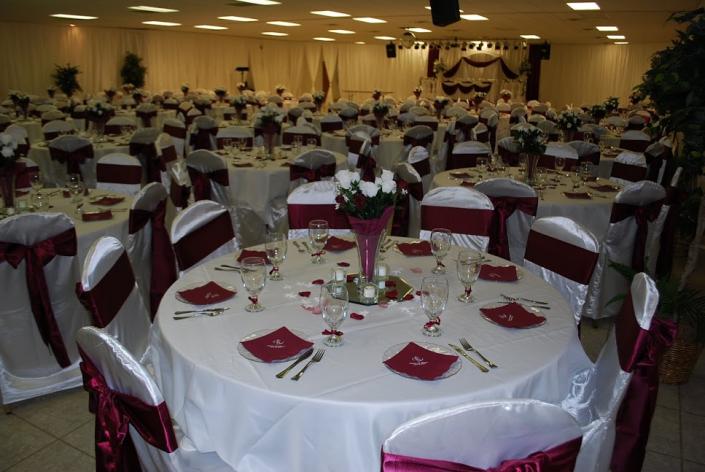 A beautiful white and burgundy reception.