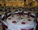 A beautiful white and burgundy reception.